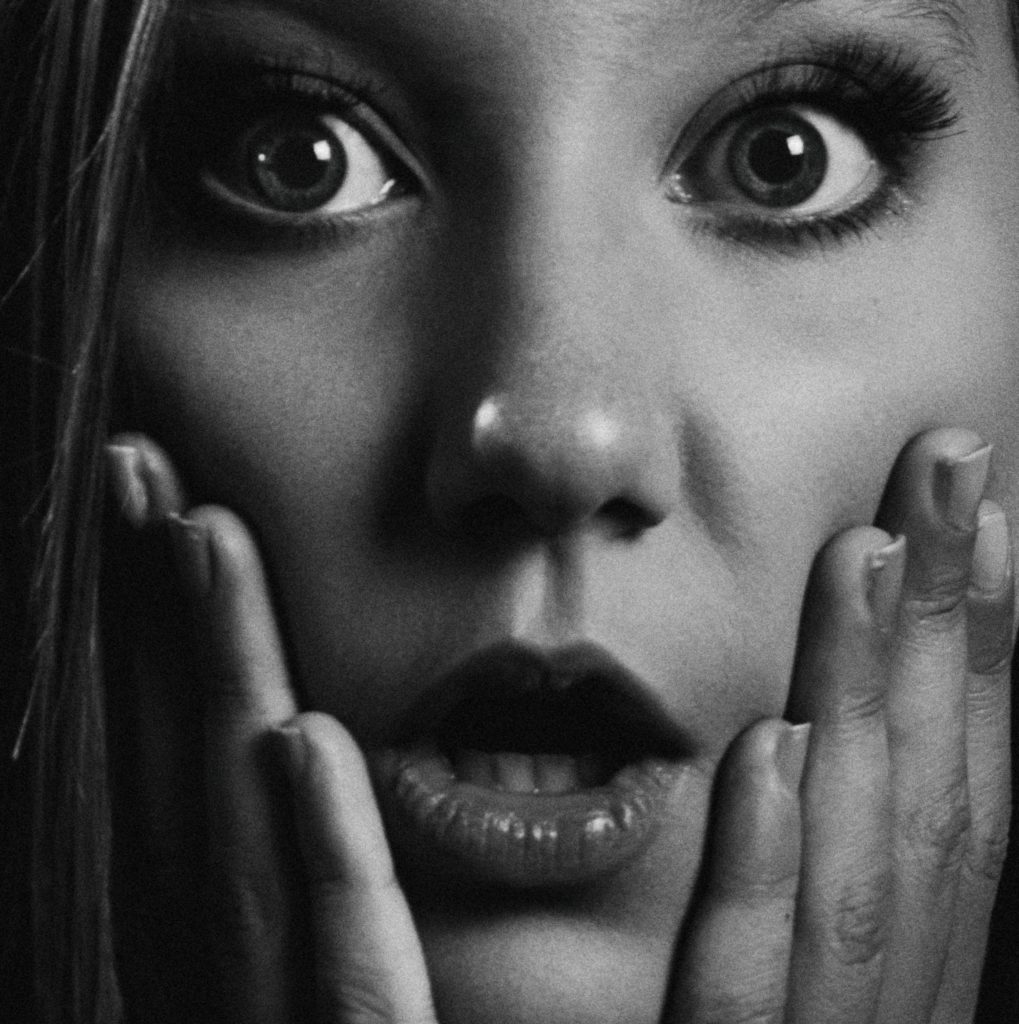 Woman making a surprised face, use emotional hooks in your title.