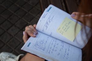 person writing a plan for their business