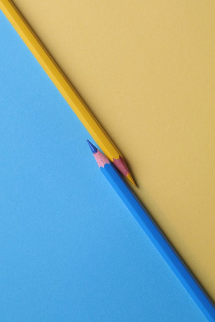 blue pencil pointing up, yellow pencil pointing down 
