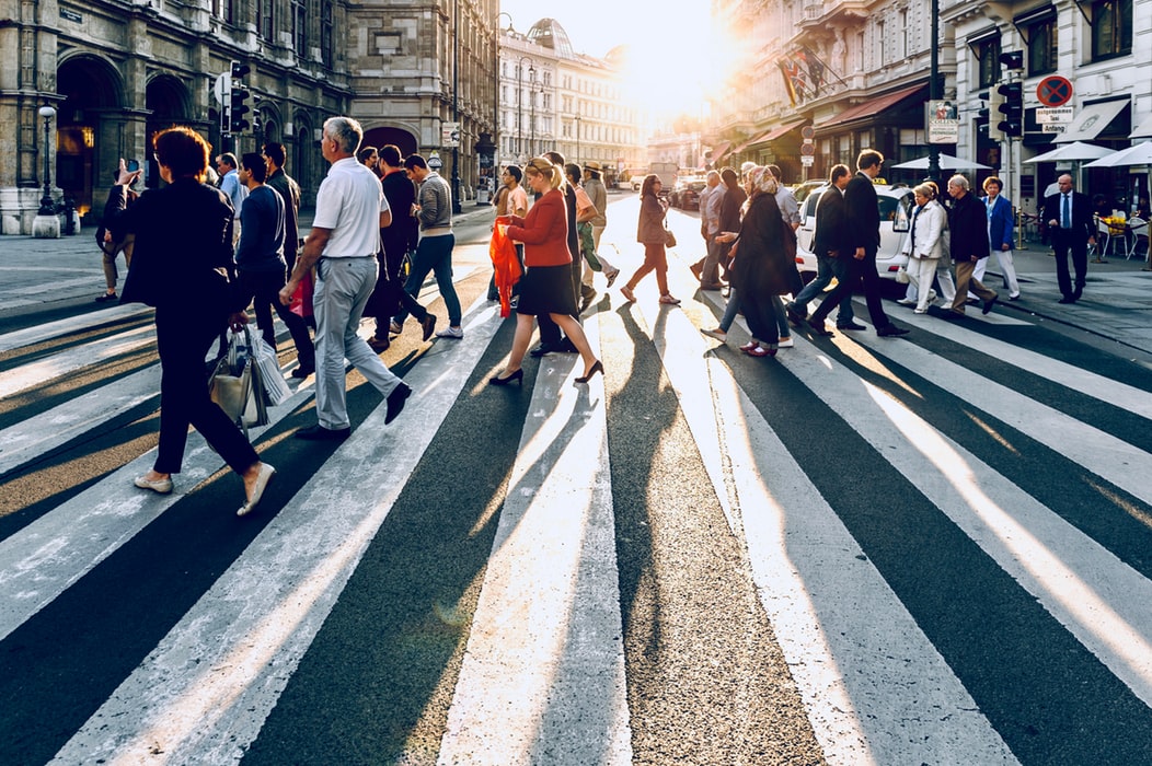 Outbound Marketing Addresses the Masses - Generalized Messages crowd of people walking across the street at sunset