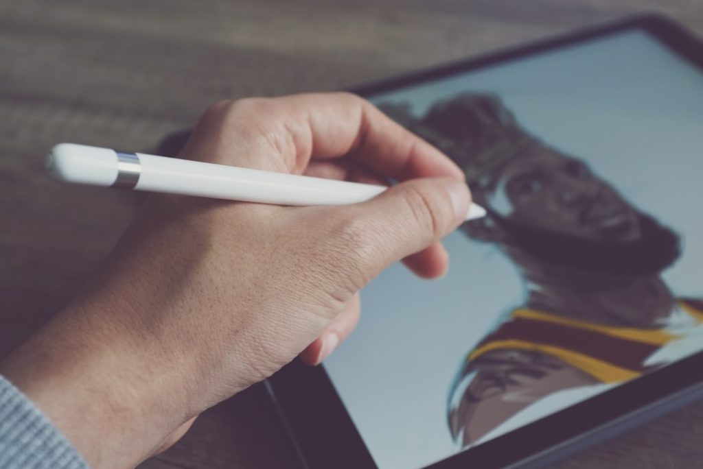 man drawing on a tablet with an ipencil