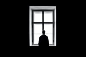 Man looking out of a window 