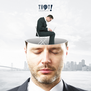 The Mindset of a Digital Marketing | A Man Sitting Using His laptop At The Head of A Closed Eyes Man.