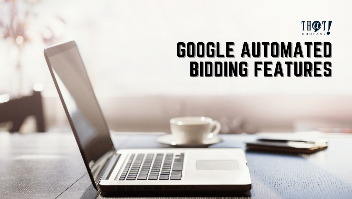Automated Bidding | A Laptop On The Top Of The Table With a Cup of Coffee and a Notebook at the Side. 