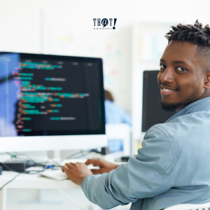 Minify and Compress Files | Man Smiling while sitting and Coding In Front of a Desktop