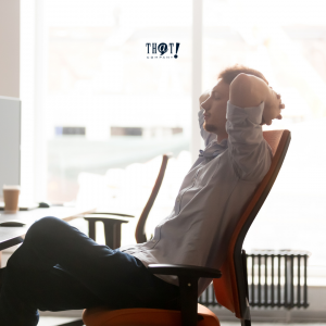 Workspace Chair | A Man Relaxingly Sitting in A Chair with His Hands Behind His Head