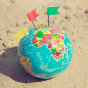 Location targeting In Digital Marketing | A Small Globe With 3 Flags (Yellow, Red and Green) Pinned On 3 Different Locations