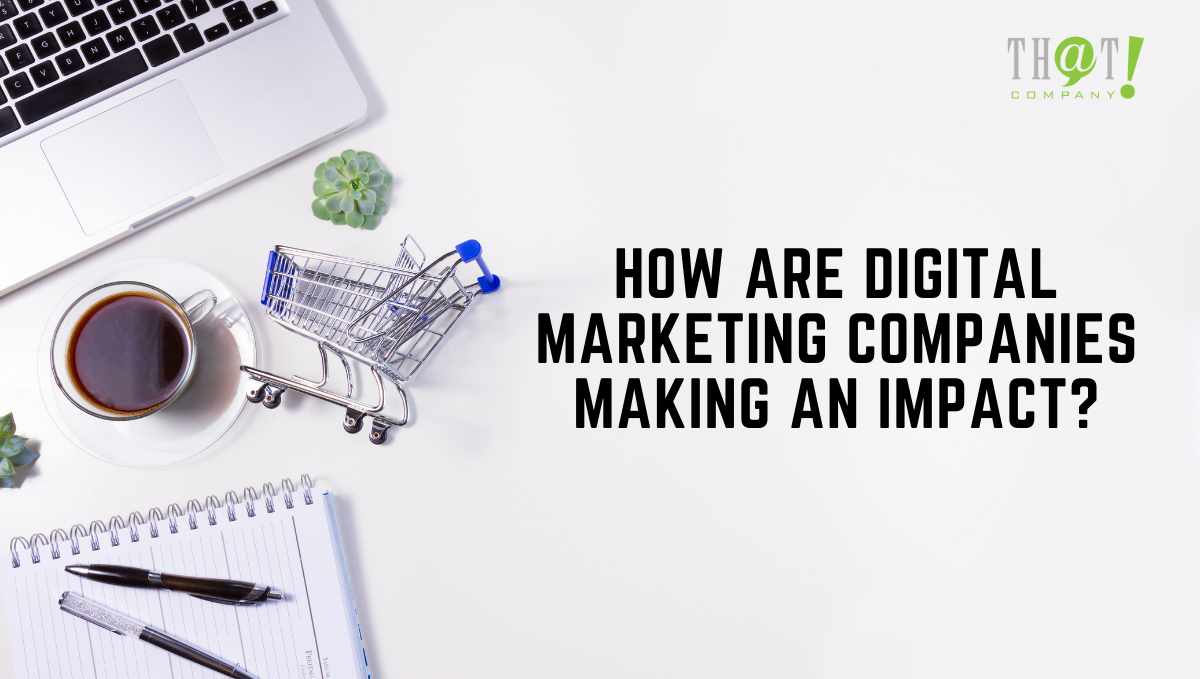How Are Digital Marketing Companies Making An Impact | An Office Table With Laptop, Coffee, Notes and Pen And a Mini Cart