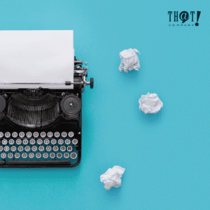 Blog Publishing | A Typewriter With Crumpled Papers On The Side