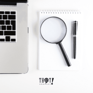 Search Console Reposts | A Laptop With Magnifying Glass And Pen On Its Side At The Top Of A Notepad