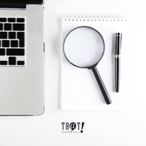 Google Analytics 4 Reports | Search Console Search Console Reposts | A Laptop With Magnifying Glass And Pen On Its Side At The Top Of A Notepad